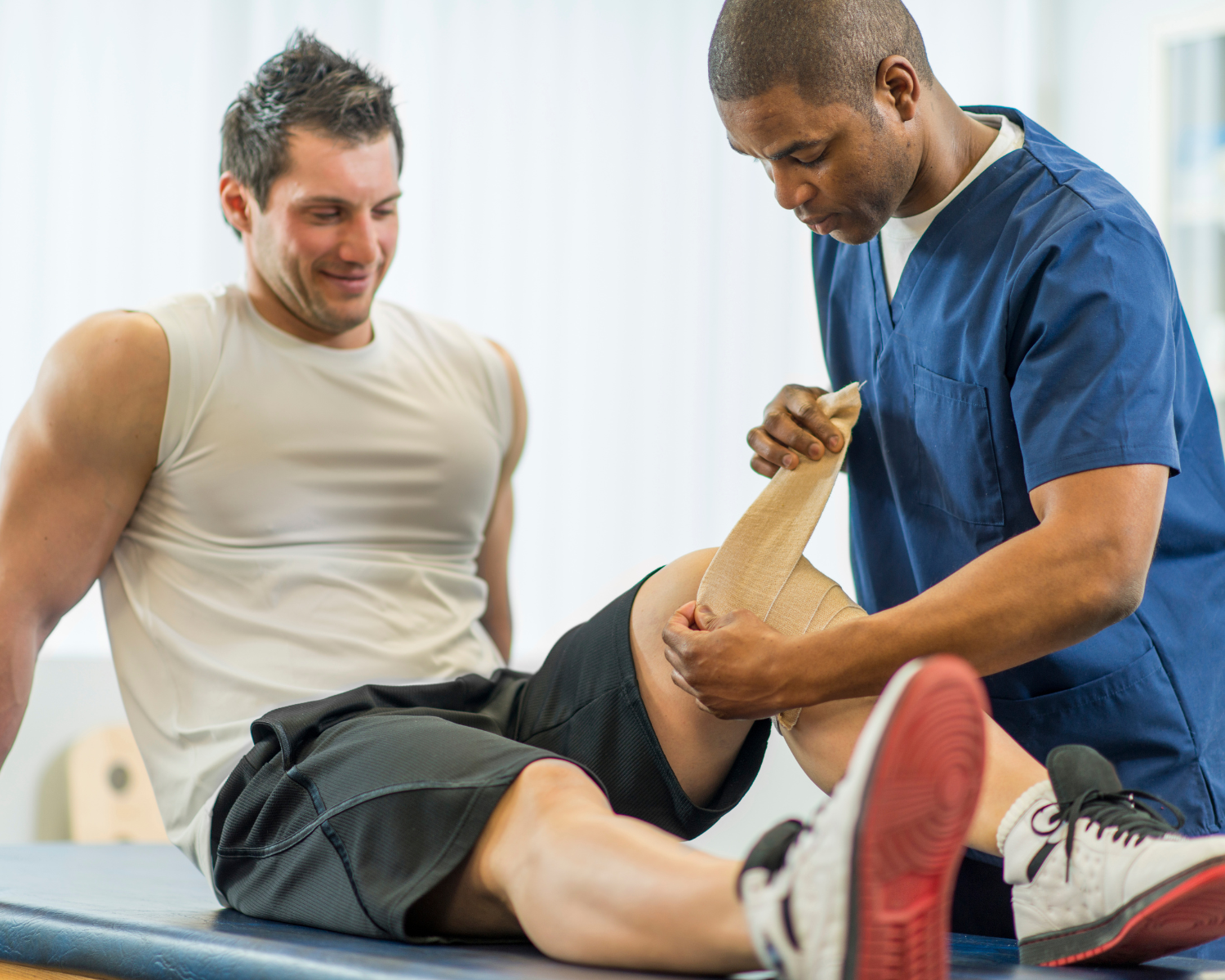 a man is having his knee examined by a physical therapist.